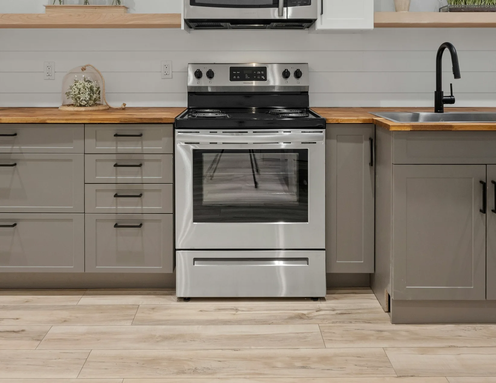 Stainless steel electric range in a kitchen