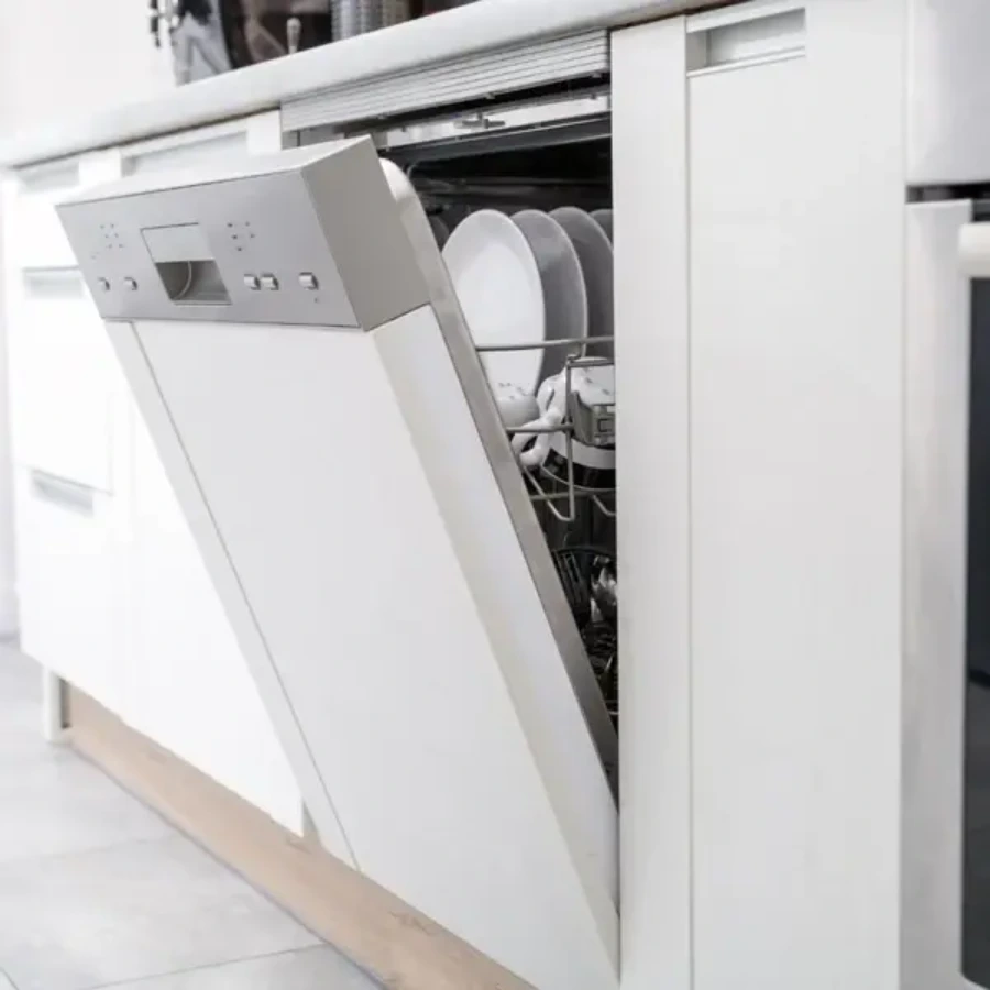 Built-in dishwasher with the door open and dishes inside
